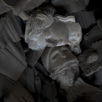 In this Friday, Nov. 20, 2017 photo, two terracotta busts of a Caryatid and the ancient Greek goddess of wisdom, Athena, are seen among other ceramic broken pieces in Haralambos Goumas' sculpture and ceramic workshop, in the Egaleo suburb of Athens. (AP Photo/Petros Giannakouris)