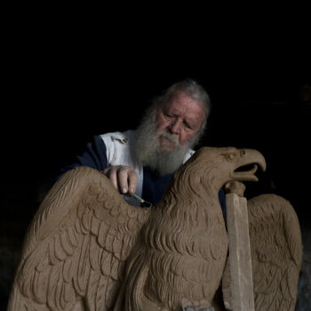 In this Tuesday, Nov. 14, 2017 photo, sculptor and ceramicist Haralambos Goumas works on a terracotta eagle, at his workshop, in the Egaleo suburb of Athens. (AP Photo/Petros Giannakouris)