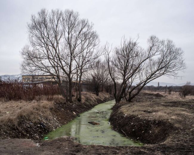 Polluted frozen river Bulgaria