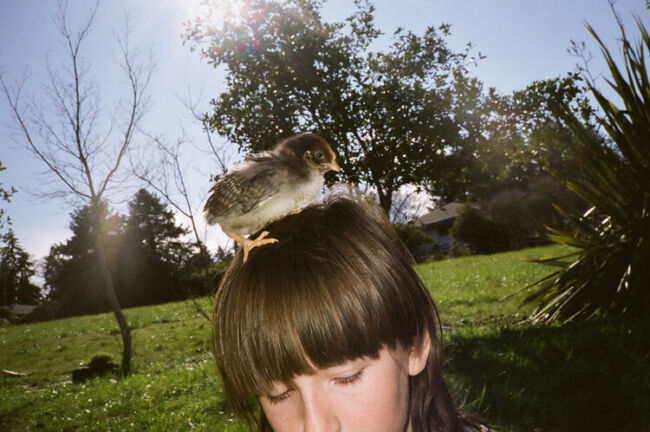 Maggie with a Chicken On Her Head