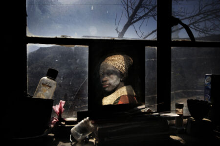 Francesco Zizola - 35 year-old Malesa Khali, mother of three, in her house. Malesa discovered she was HIV positive in 2005. Her husband died in 1998 from AIDS. She is currently on ARV’s
and receives food from the World Food Program. Waterfall, Lesotho. July 2006.