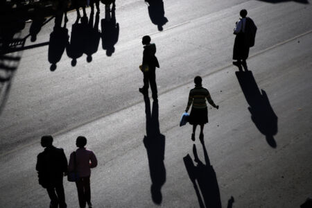 Francesco Zizola - Passers-by in the centre of Maseru, Capital city of Lesotho. July 2006.